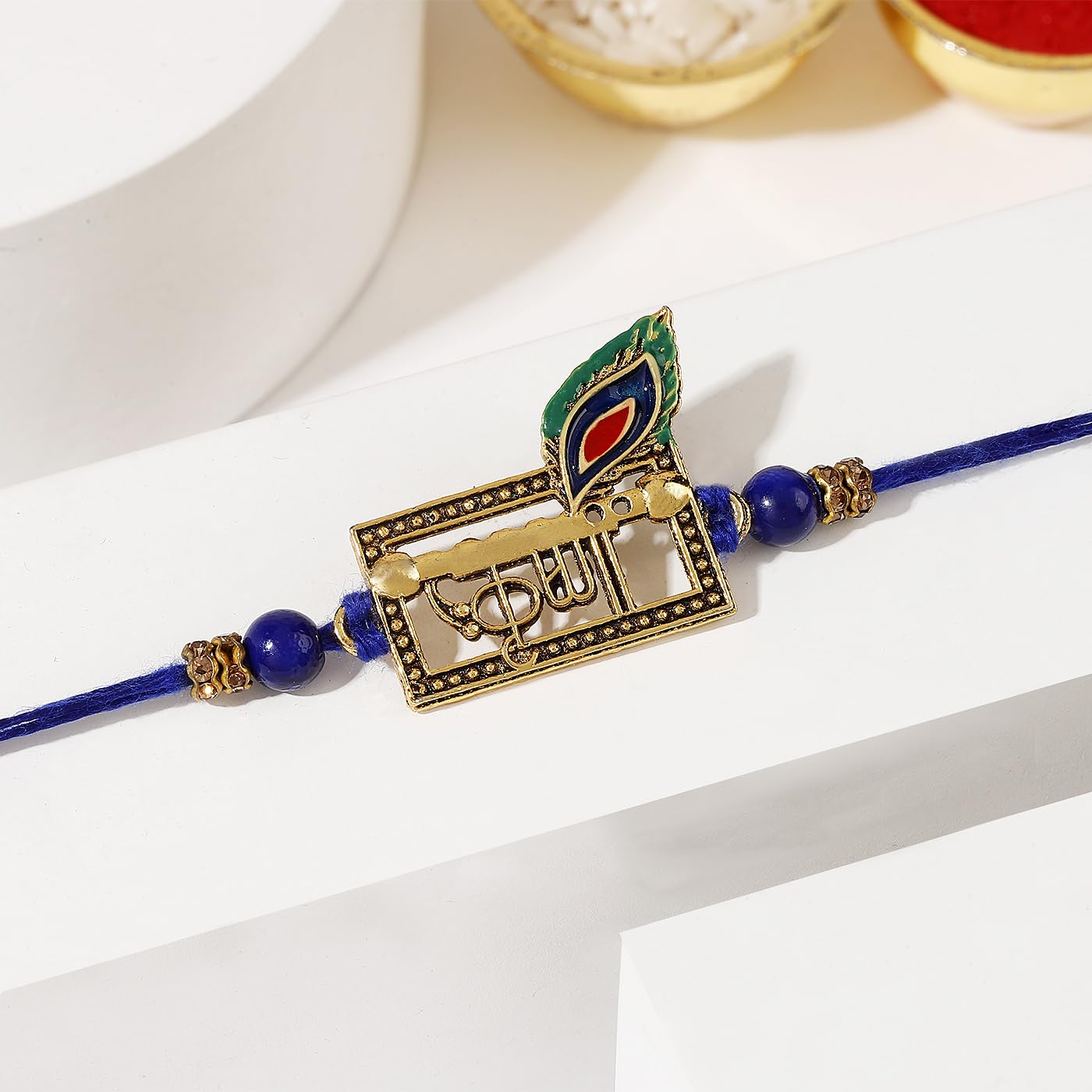 IGP Royal Peacock Feather Krishna Rakhi with Decorative Blue Beads and Gold-Tone Accents, Traditional Handcrafted Raksha Bandhan Rakhi for Brother