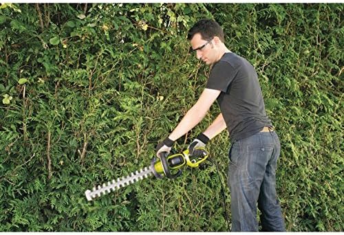 Man trimming a hedge with Ryobi hedge trimmer