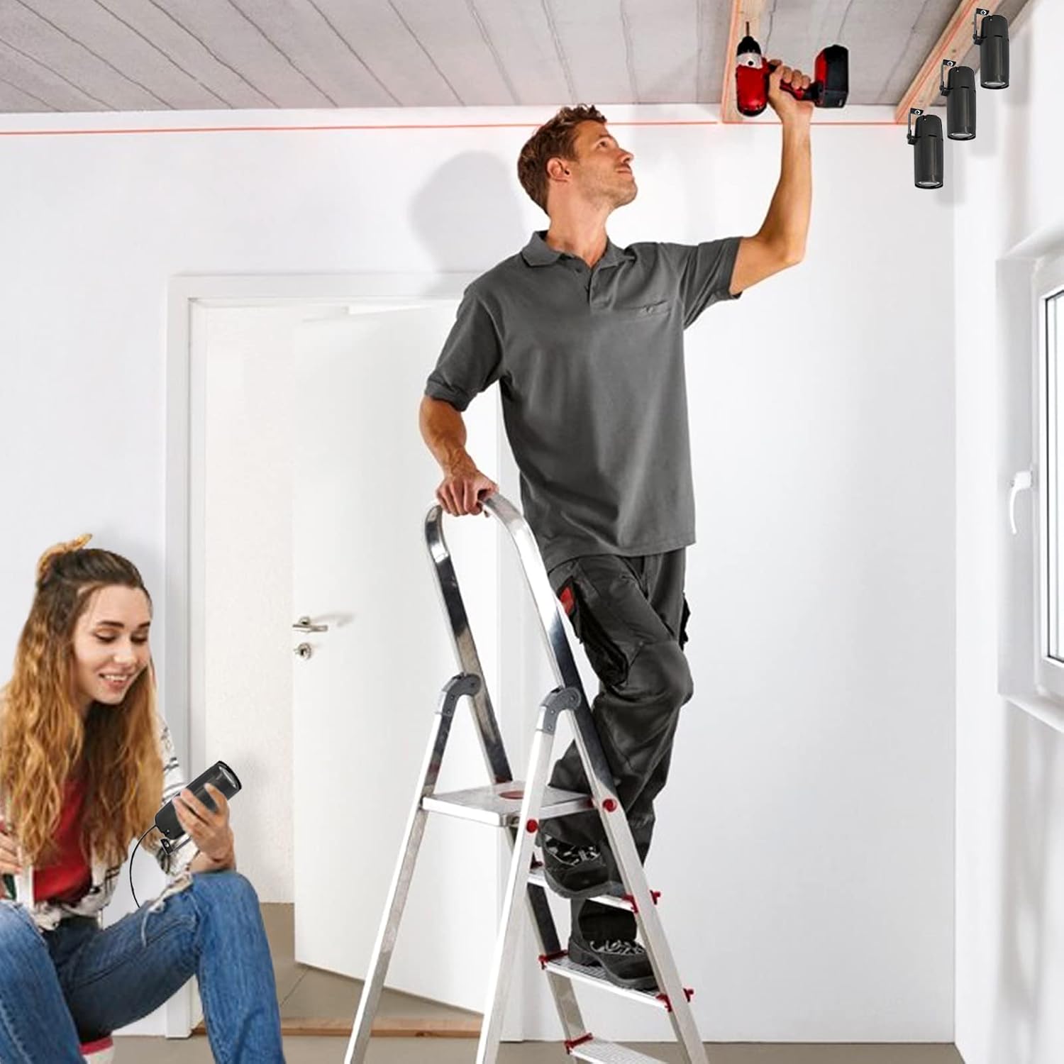 Man installing U`King Pin Spot Lights on a ceiling