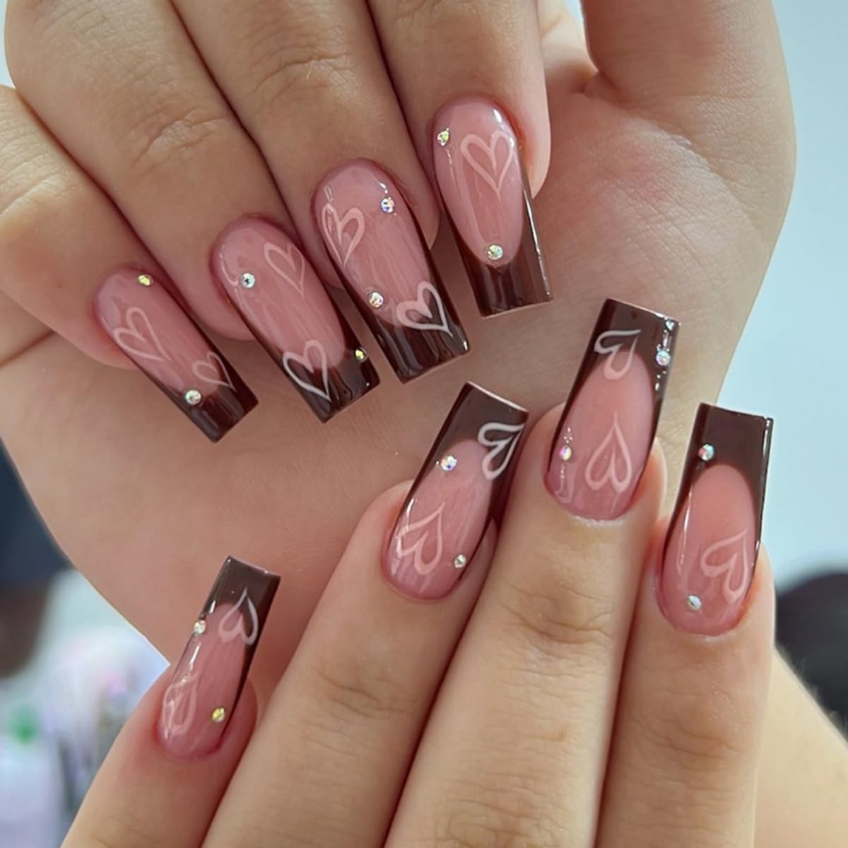 24Pcs CEWEWP Long Coffin Press on Nails Brown French Tip Fake Nails Pink Glue on Nails Love False Nails with Spot Drilling Designs Full Cover