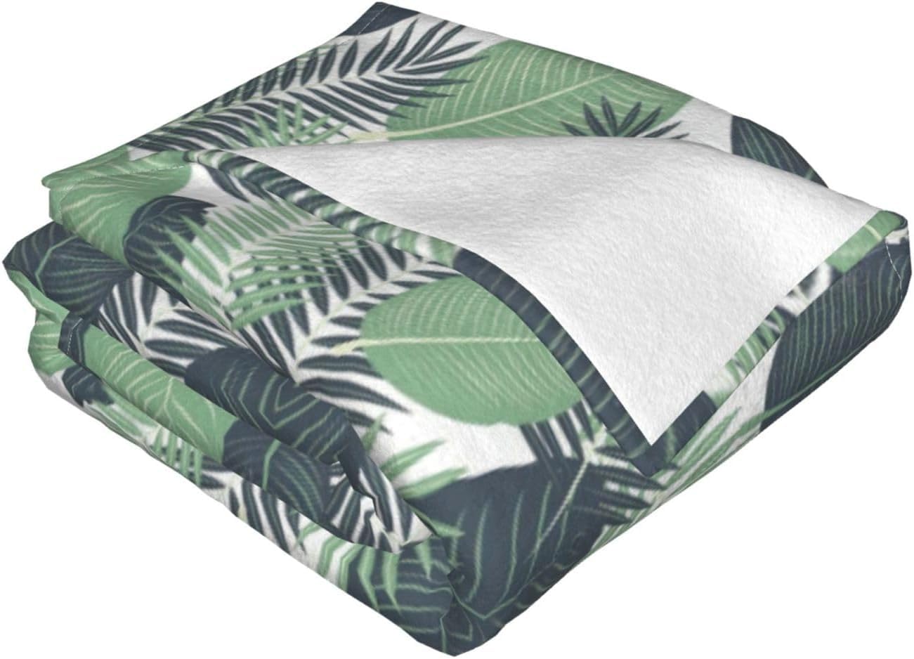 Couverture douce feuilles tropicales pour vos soirées cocooning au salon