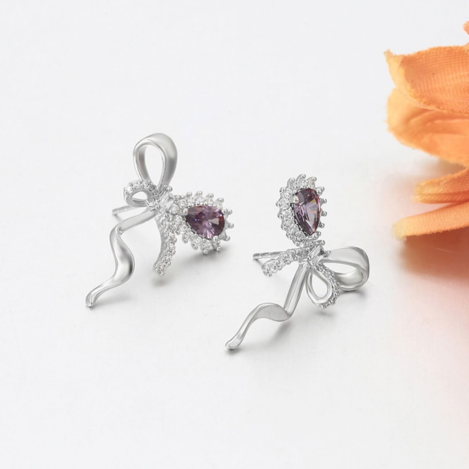 Pendientes con nudo de mariposa, amatista y moissanita