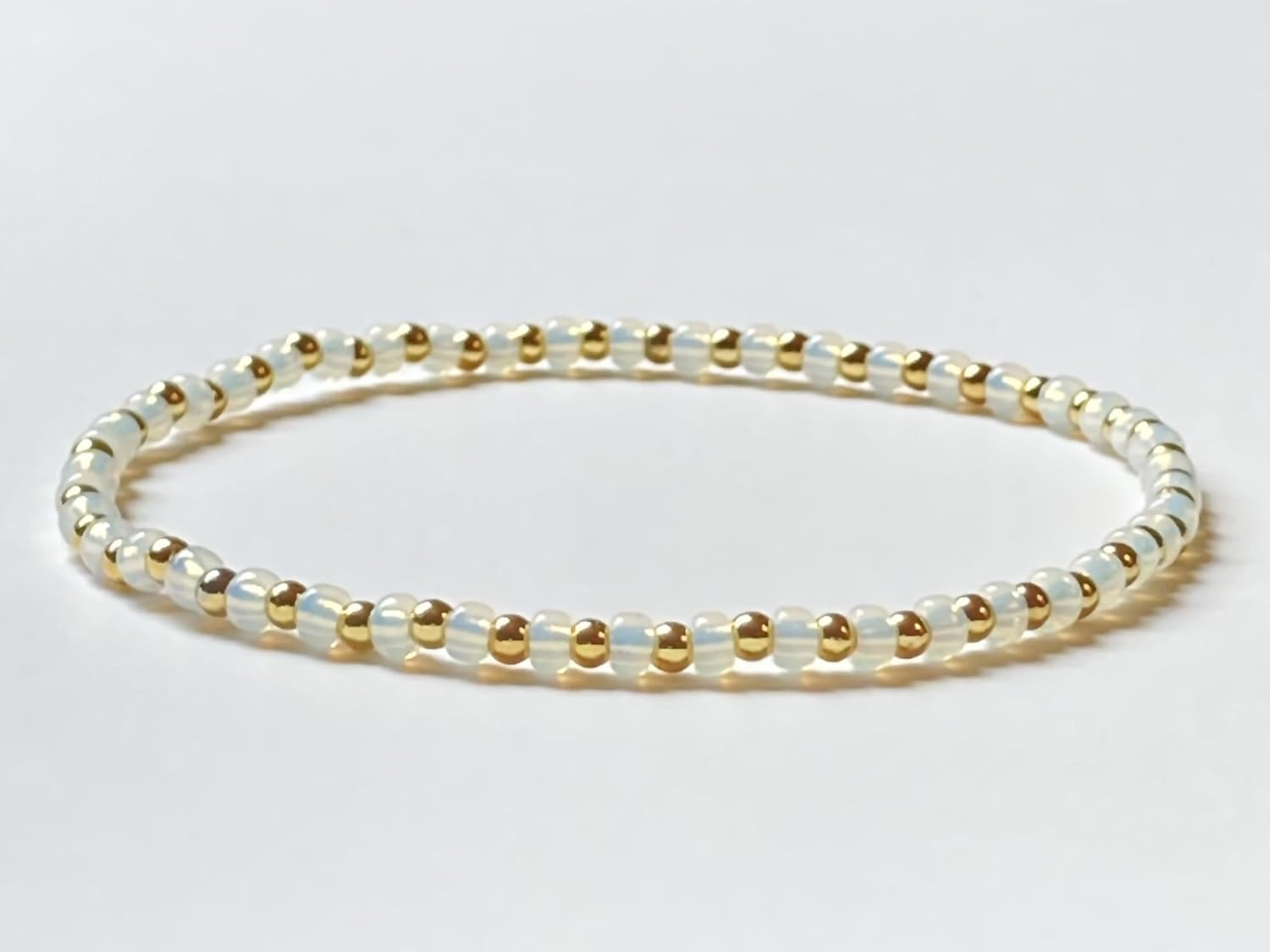 Handmade White Glass Beaded Stretch Bracelet with Solid Brass Accents | Minimalist Boho Style Jewelry for Women - Image 2