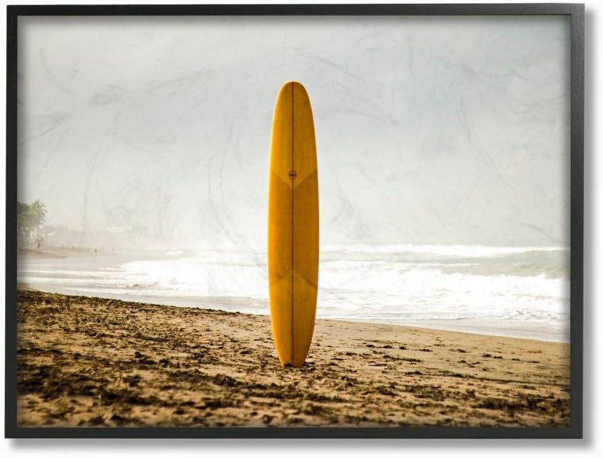 Stupell Industries Yellow Surfboard in Sand Near Shore Photograph