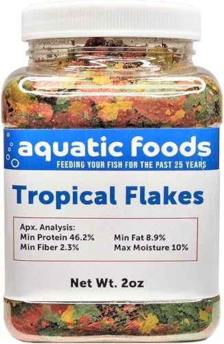 Copos de pescado tropical premium, para todos los peces tropicales de la comunidad, cíclidos y peces de estanque. Frasco pequeño de 2 onzas disponible en Yaxa Peru