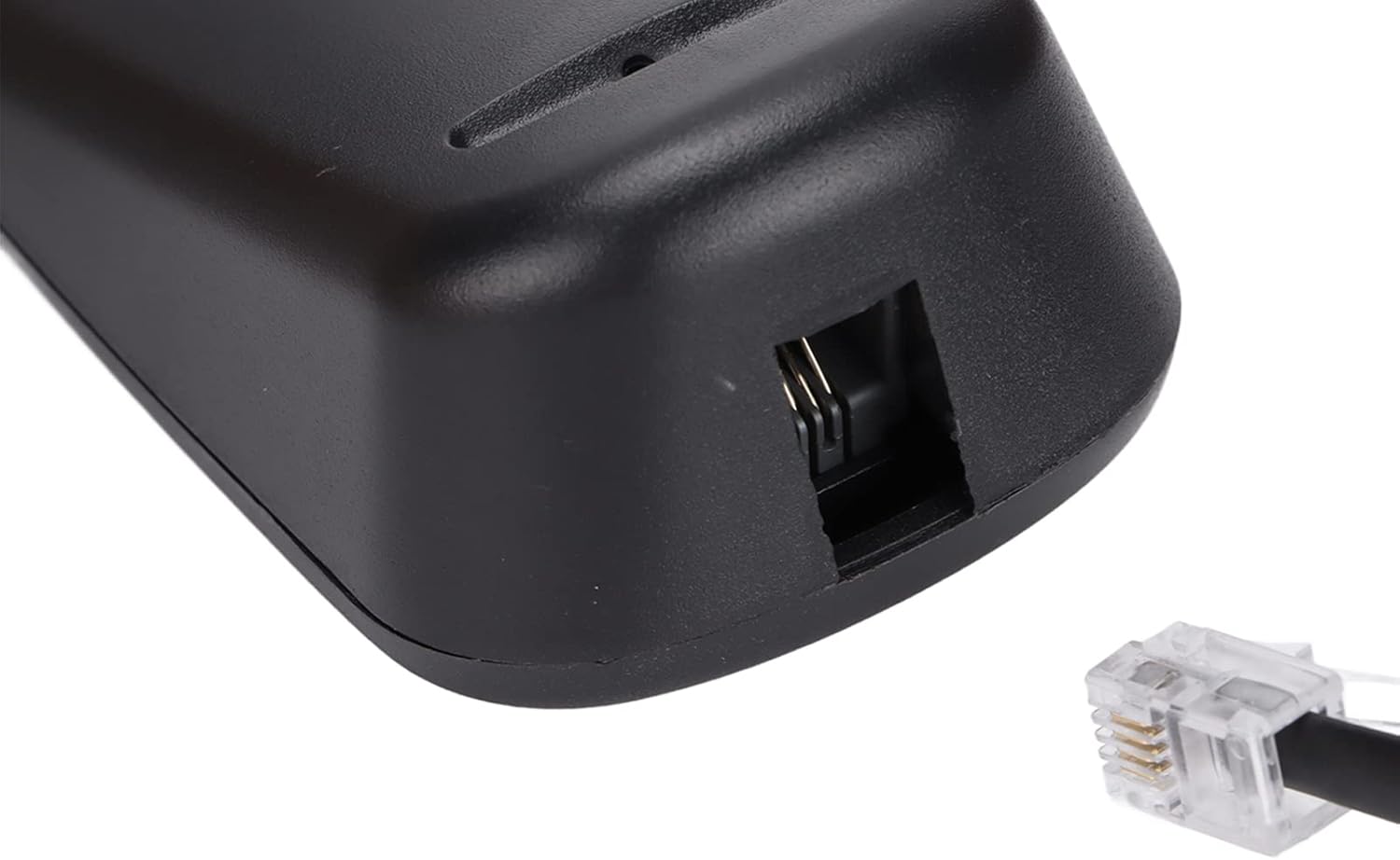 Close-up of handset cord connection port on the telephone base