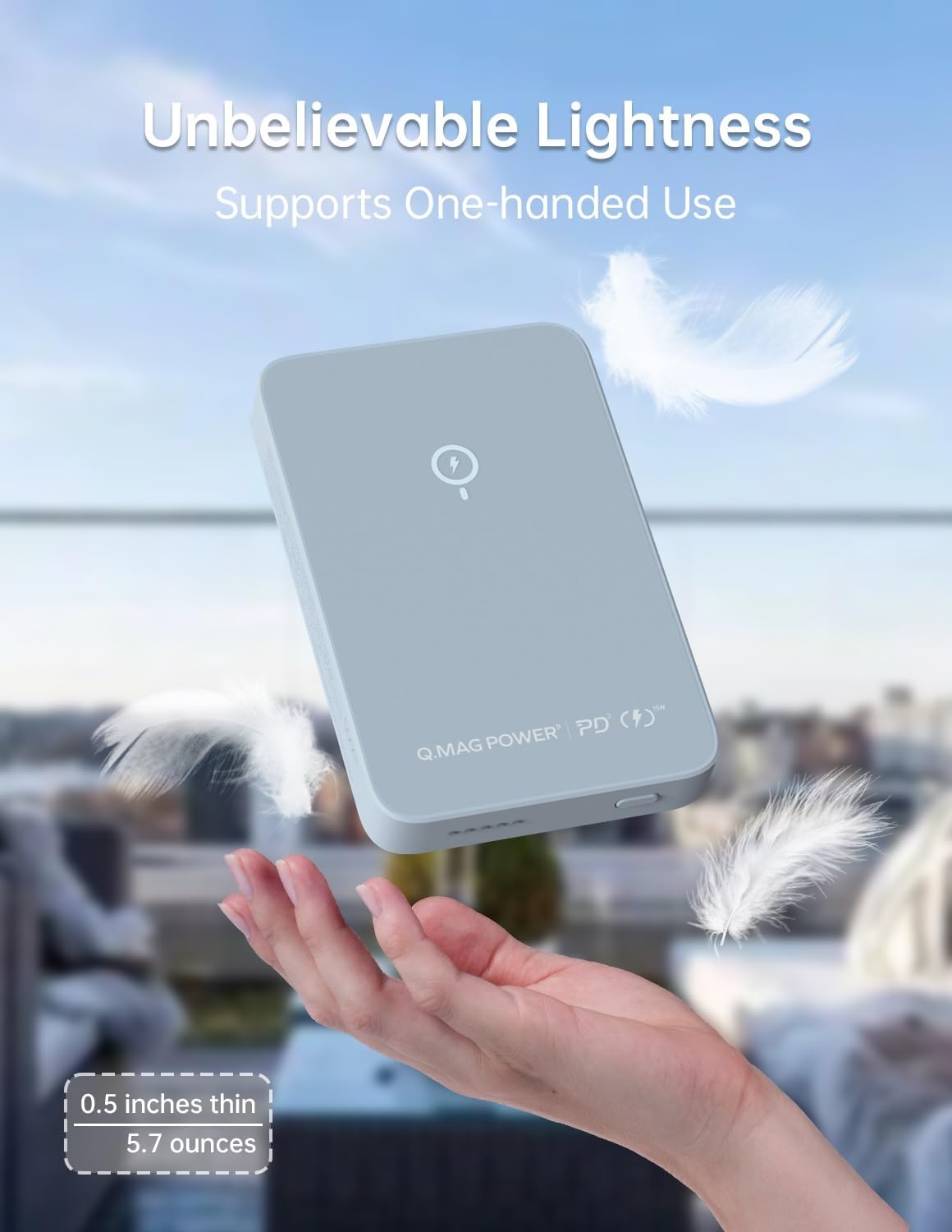 MOMAX power bank held in a hand with feathers floating around, emphasizing its lightness
