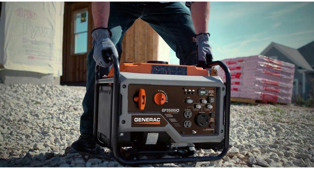 Person carrying the Generac GP3500iO Portable Inverter Generator by its frame.