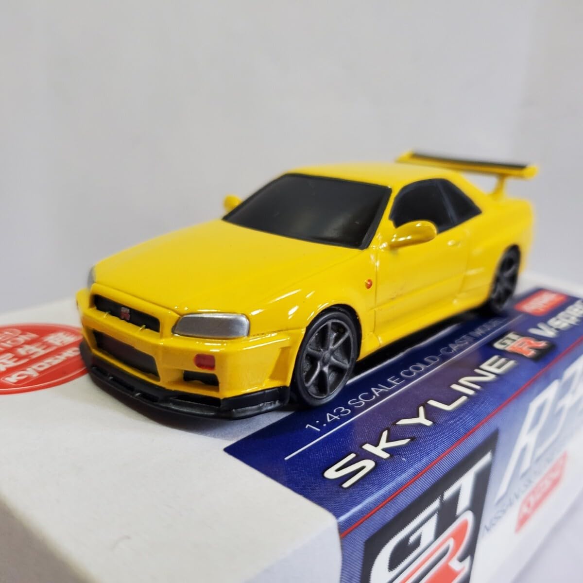 Amazon | 京商 1/43 「限定生産 SKYLINE R34 GT-R V-SPEC」黄色