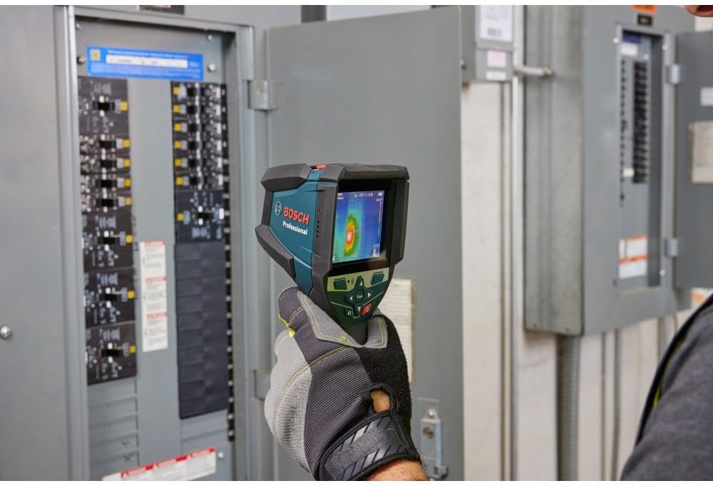 User inspecting an electrical panel with the thermal camera