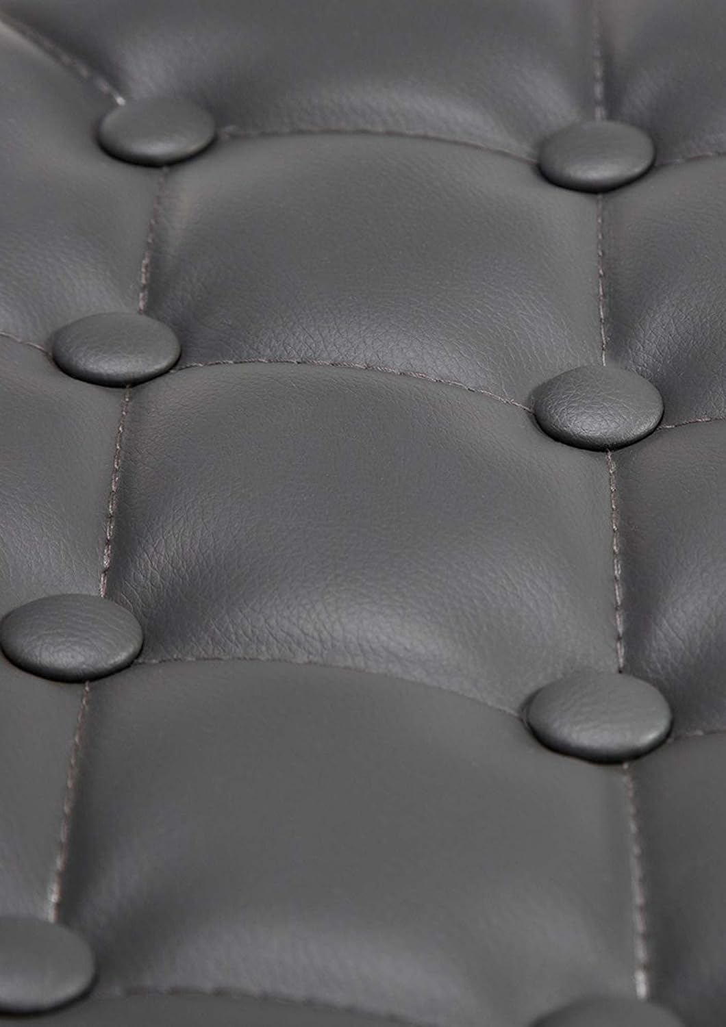 Close-up of tufted faux leather upholstery on CLP Lounger Dublin chair