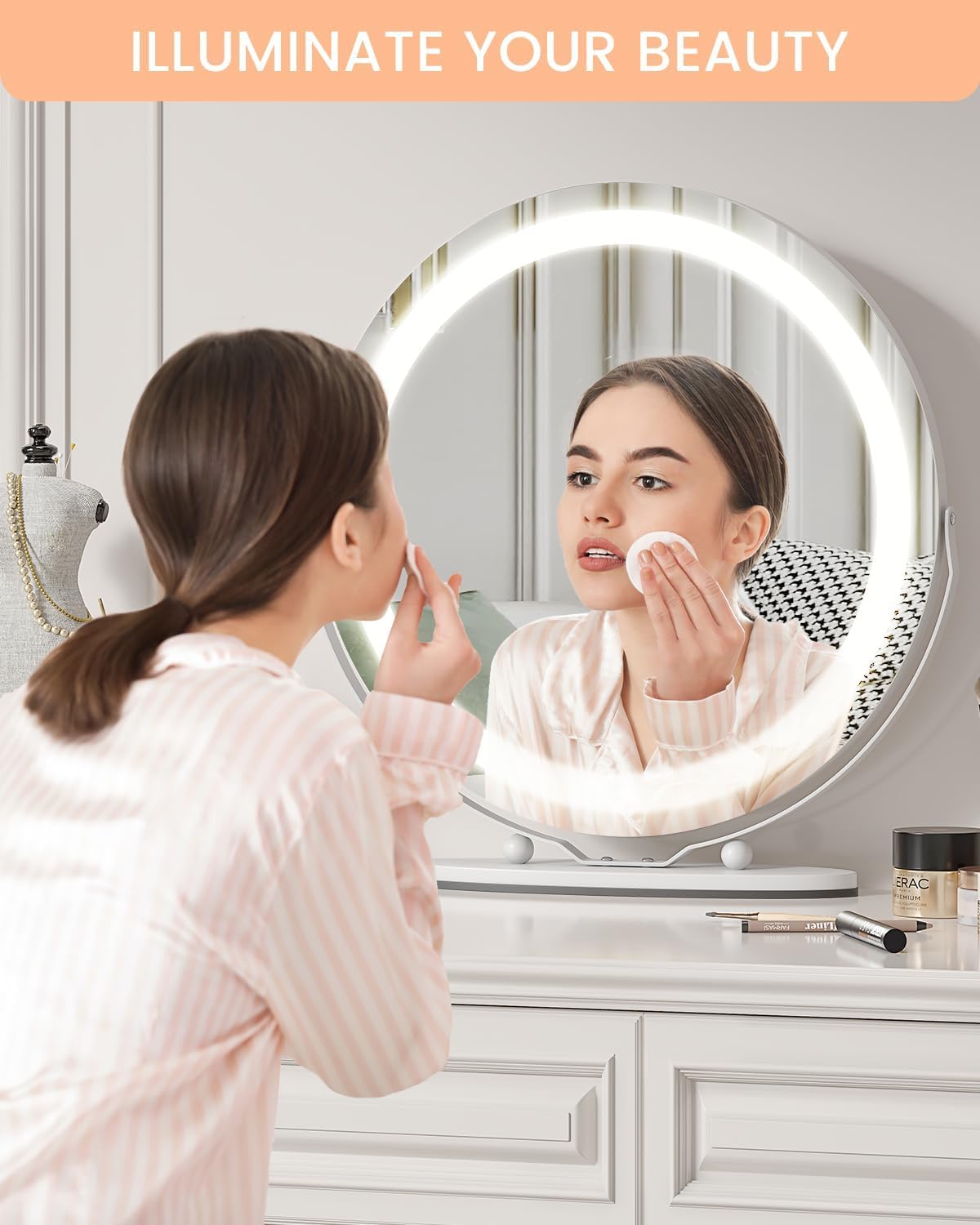 Woman applying makeup using the illuminated mirror