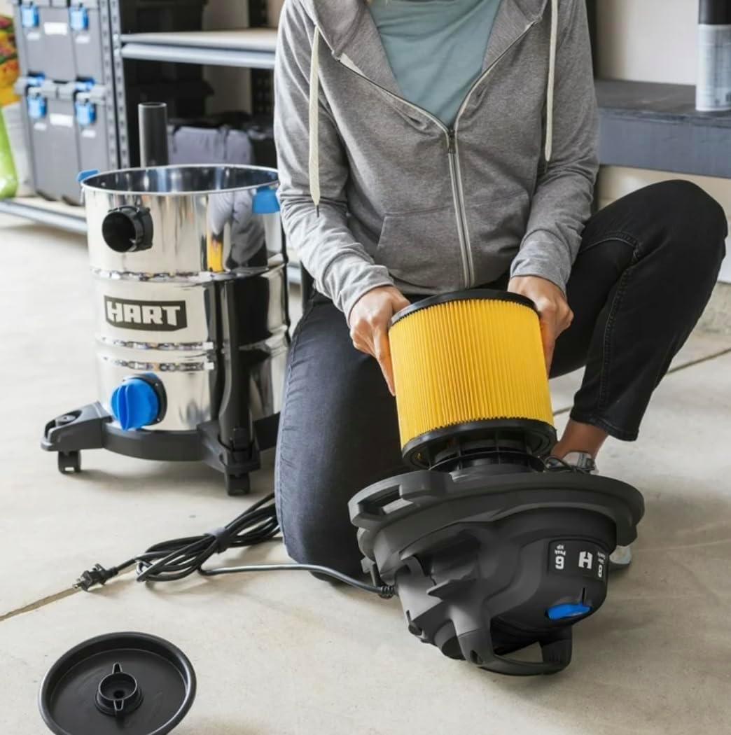 Person installing a cartridge filter into the vacuum