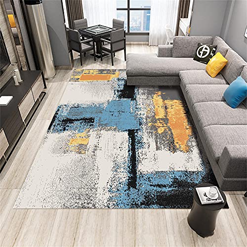 Decoration de chambre avec un tableau bleu et jaune pour dynamiser un mur blanc - 2