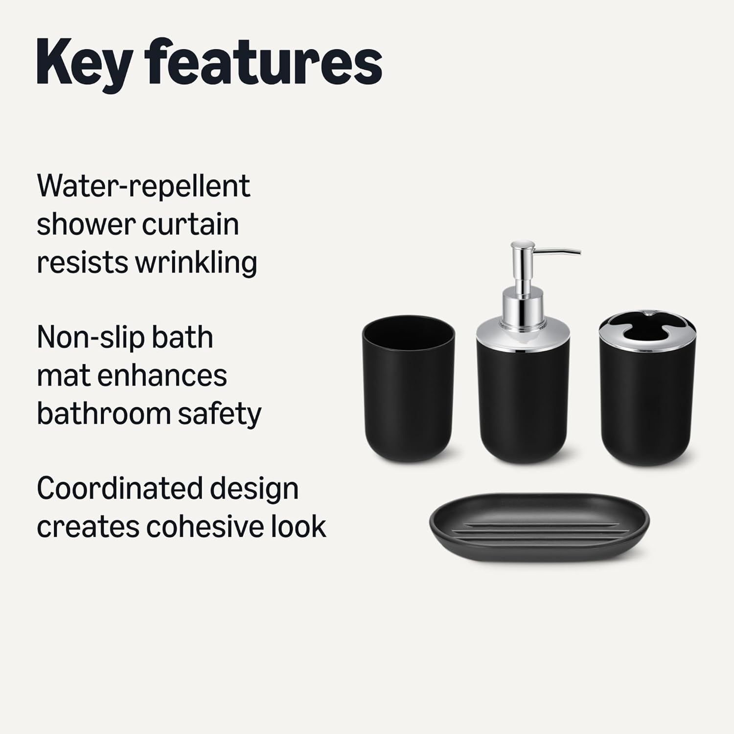Close-up of the four black plastic bathroom accessories: a tumbler, a soap dispenser with a silver pump, a toothbrush holder, and an oval soap dish.