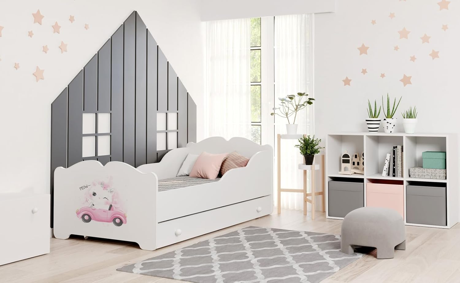Fully assembled KOBI Anna Children's Bed with storage drawer in a child's room setting.