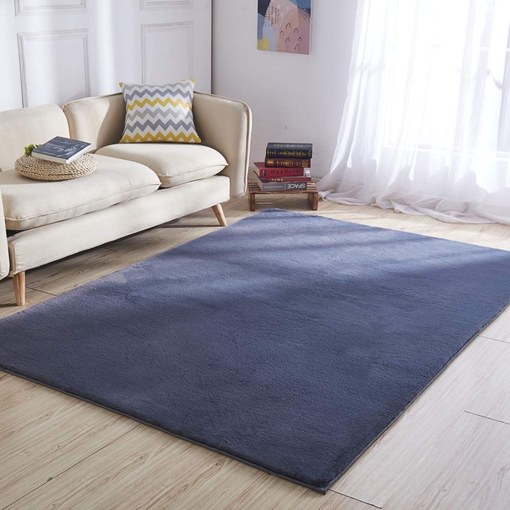 Tapis de salon moderne marine pour créer un coin lecture scandinave douillet