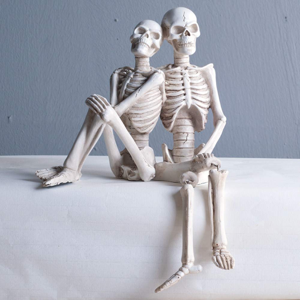 Petite statue couple de crânes abstrait en résine artisanat d'art