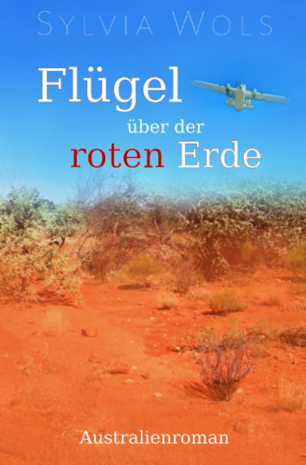 Flügel über der roten Erde