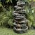 Alpine Corporation WIN1146 Outdoor Floor Cascading 8-Tiered Rock Garden Water Fountain with LED Lights, 58", Gray