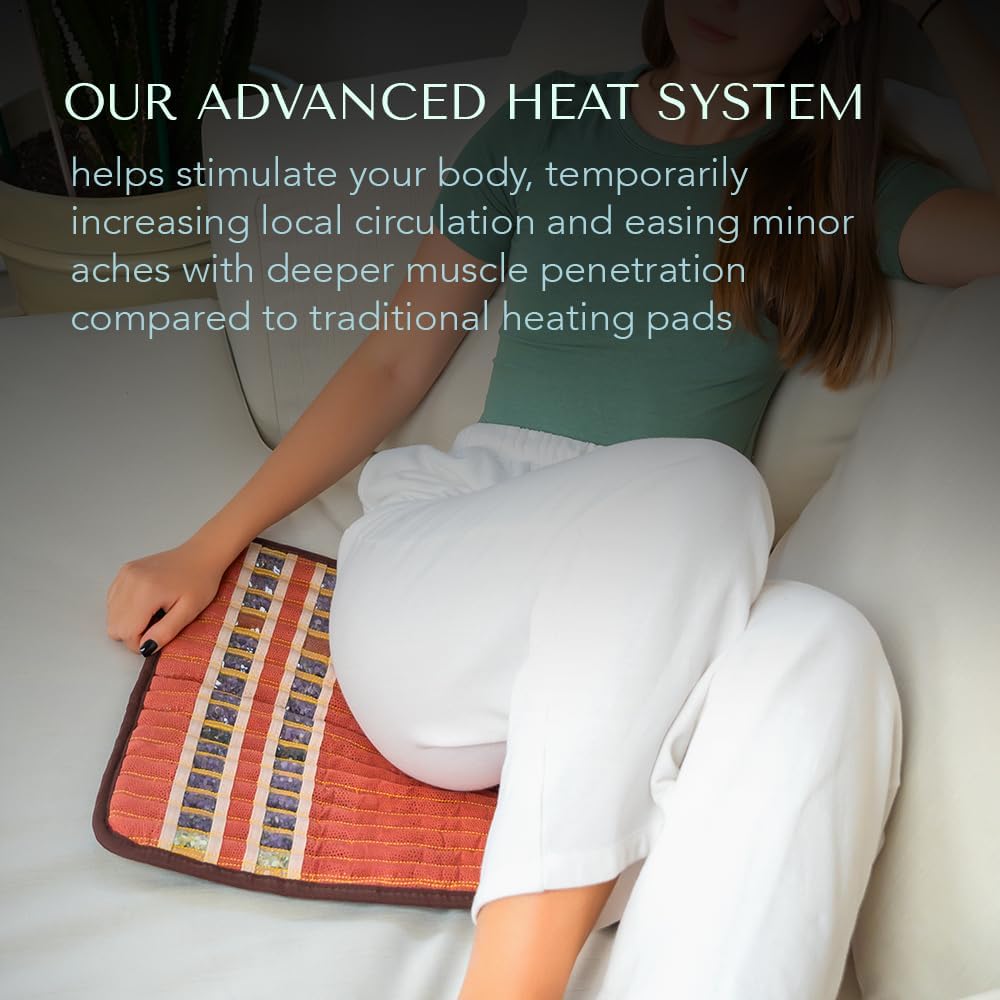 Person using HealthyLine heating pad on a couch
