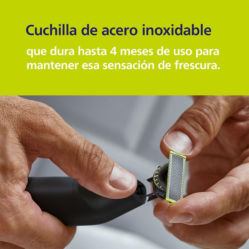 Hands replacing the stainless steel blade on a Philips OneBlade Pro 360.