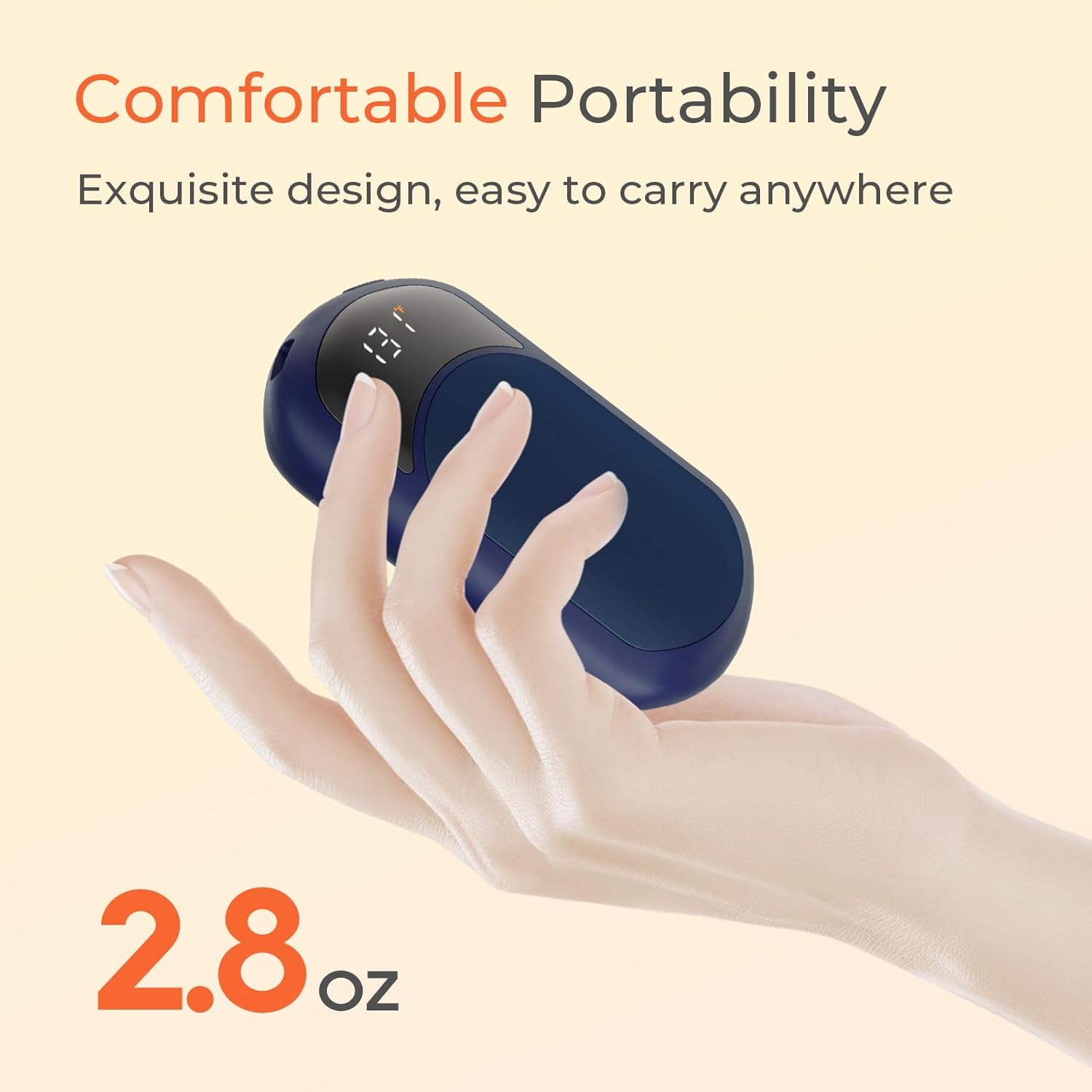 Hand holding the compact Hotdot hand warmer, illustrating its portable size