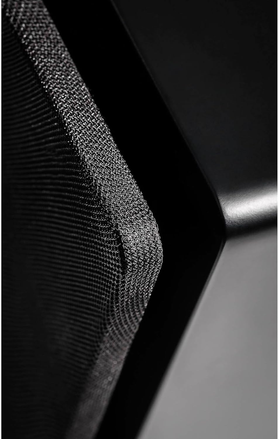 Close-up of subwoofer grille texture