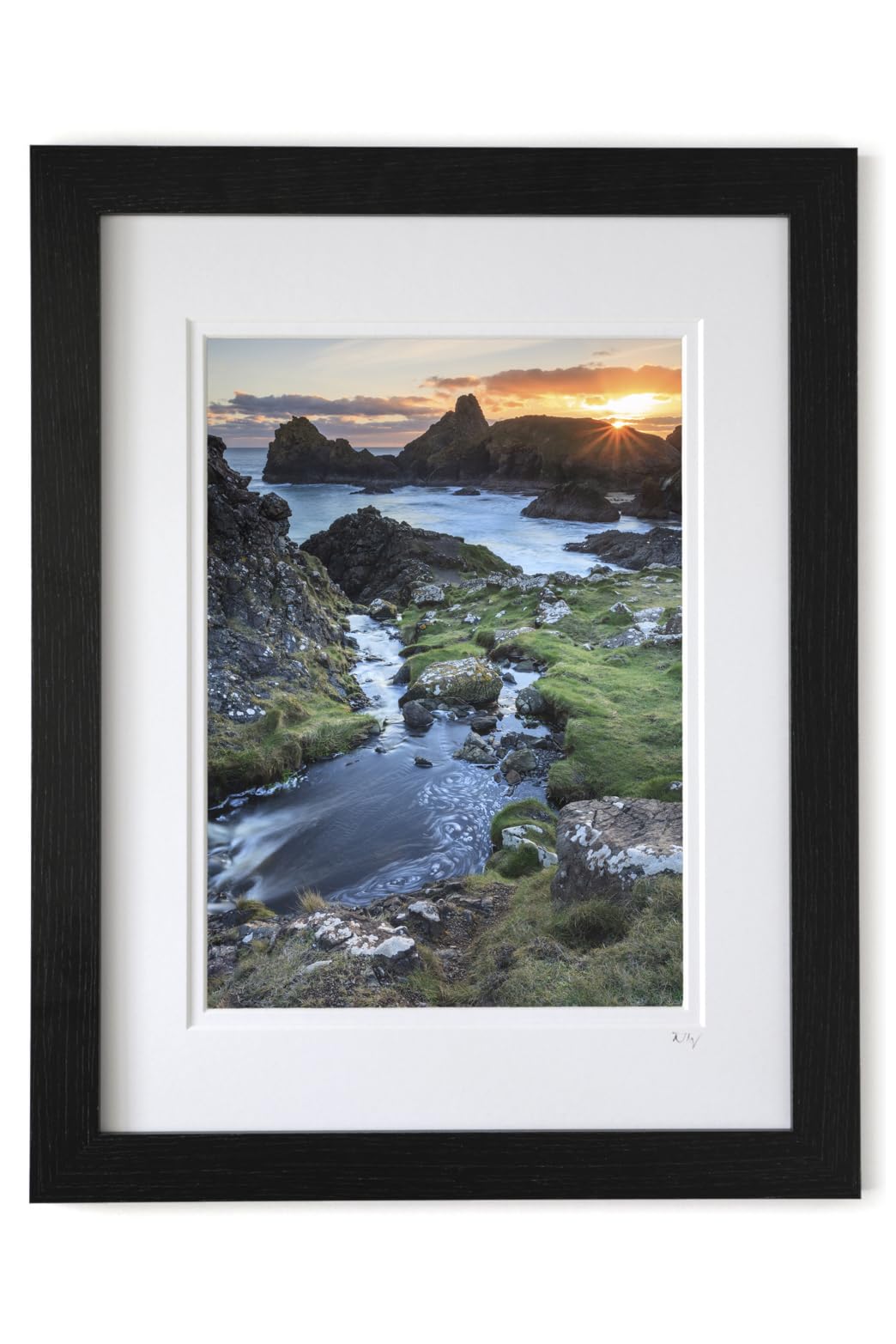 Mounted or framed photograph featuring the setting sun at Kynance Cove in Cornwall in a choice of colour photography photo sizes.