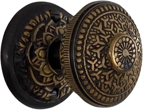 The King's Bay Floral Round Rosette Passage Set in Highlighted Bronze with Rice Door Knobs