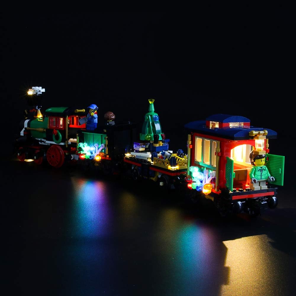 Close-up of the illuminated rear carriage of the LEGO Winter Holiday Train, showing interior and exterior lighting details.