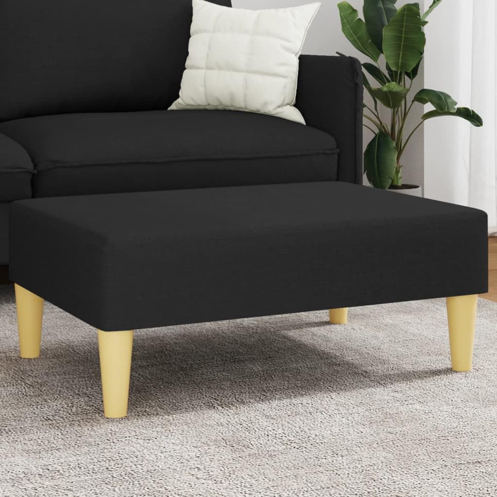Tabouret en tissu noir pour créer un coin lecture dans la chambre