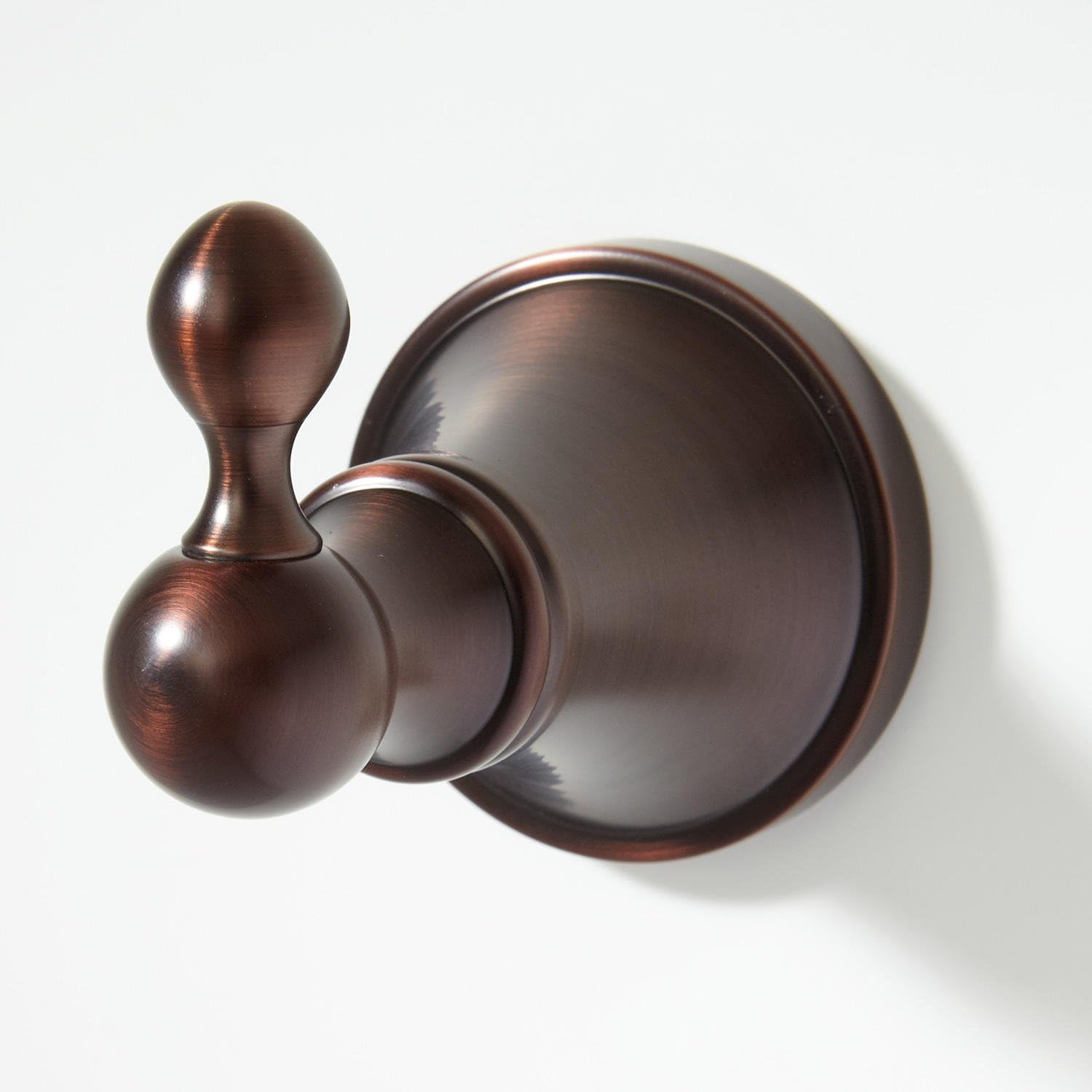 Robe hook secured to wall