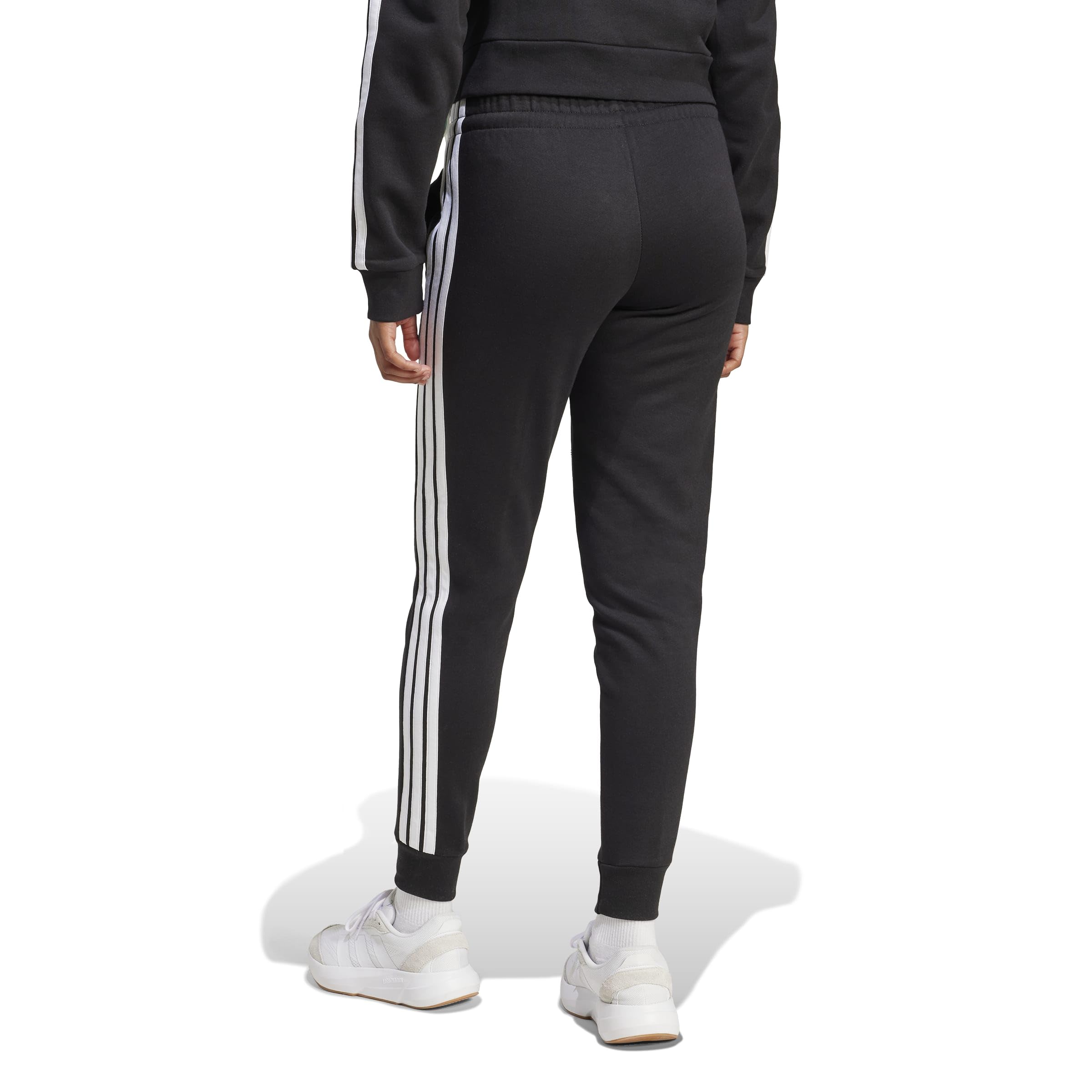 adidas ESSENTIALS 3-STRIPES FLEECE SLIM PANTS - Spodnie golfowe Kobiety