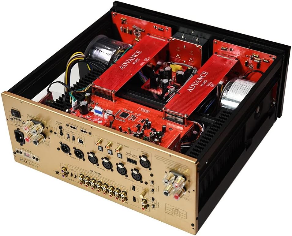 Vinklet indvendig view of the Advance Paris A12 Classic amplifier, showing the dual mono construction with two large toroidal transformers and red circuit boards.