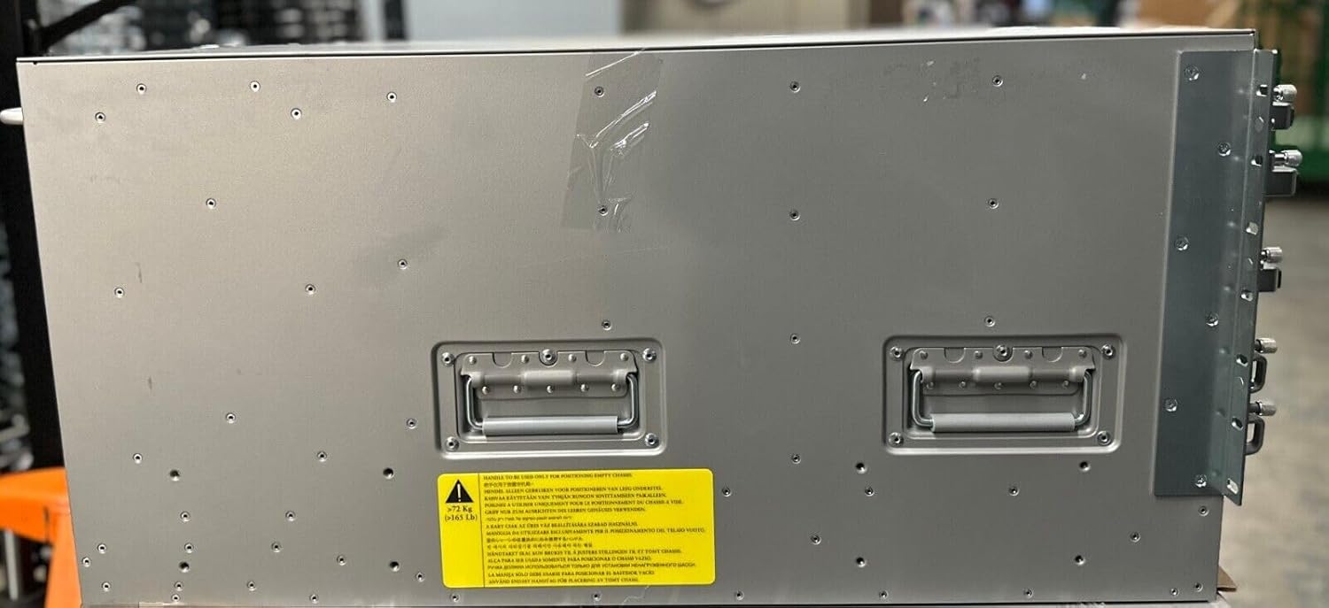 Side view of the Cisco Nexus 7706 chassis showing handles and a warning label indicating the weight of the empty chassis (372 kg).