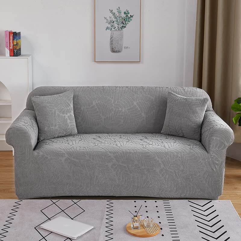 Housse de canapé extensible gris pour salon familial et chaleureux