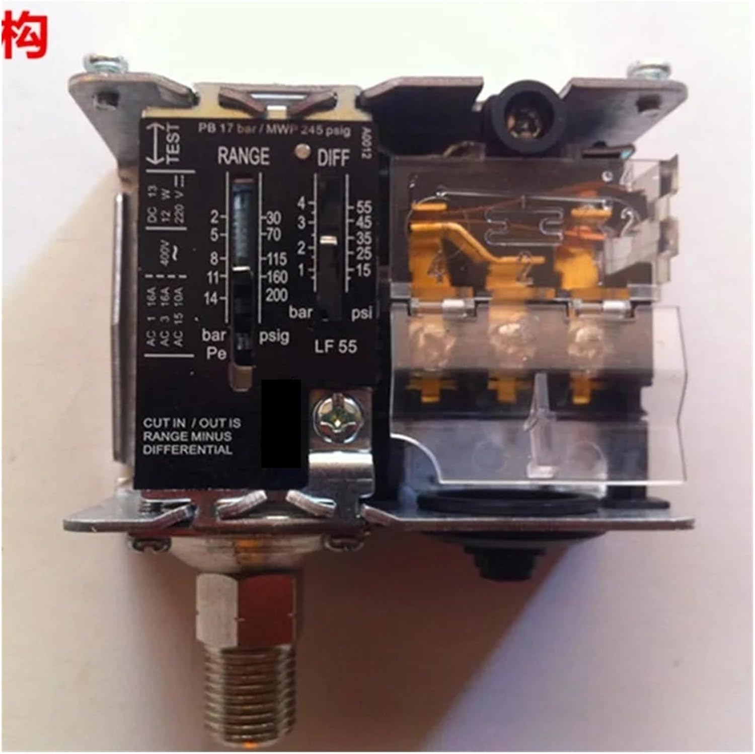 Internal view of the pressure switch with electrical connections and adjustment mechanism