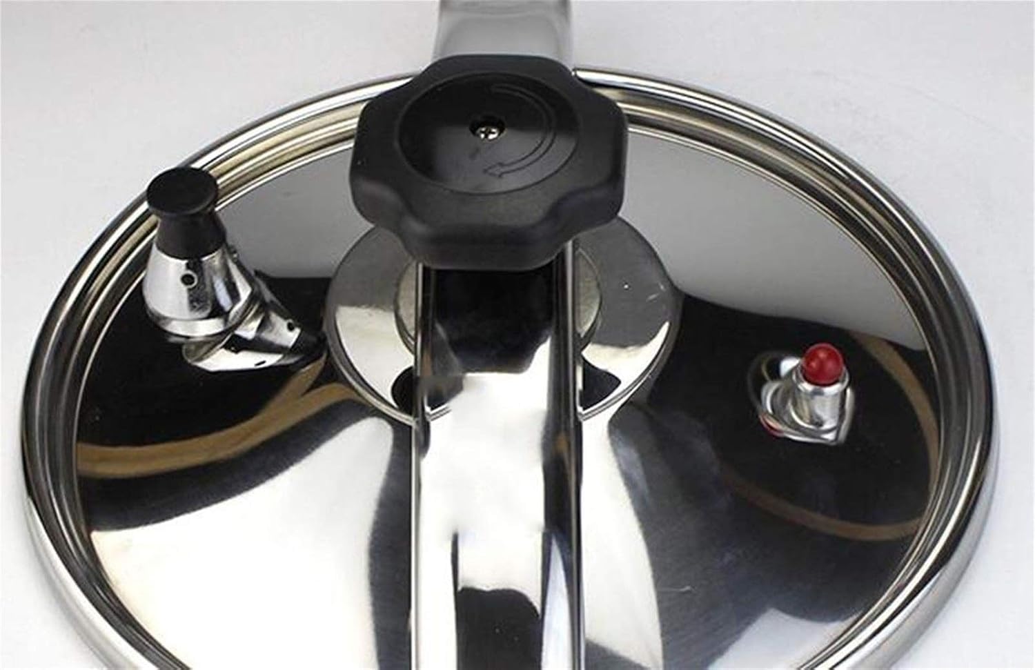 Close-up of pressure cooker lid with safety valves