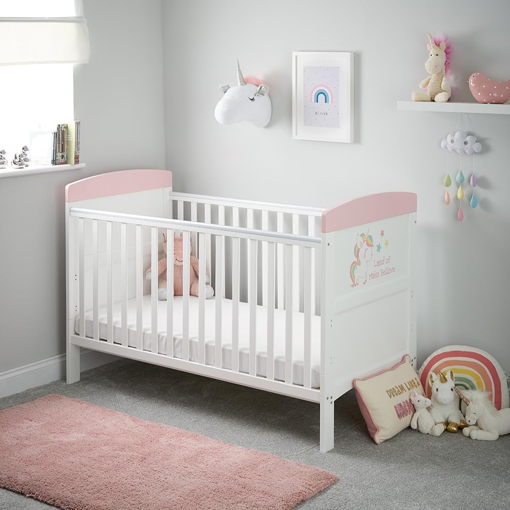 White Obaby Grace Inspire cot bed with unicorn print end panel