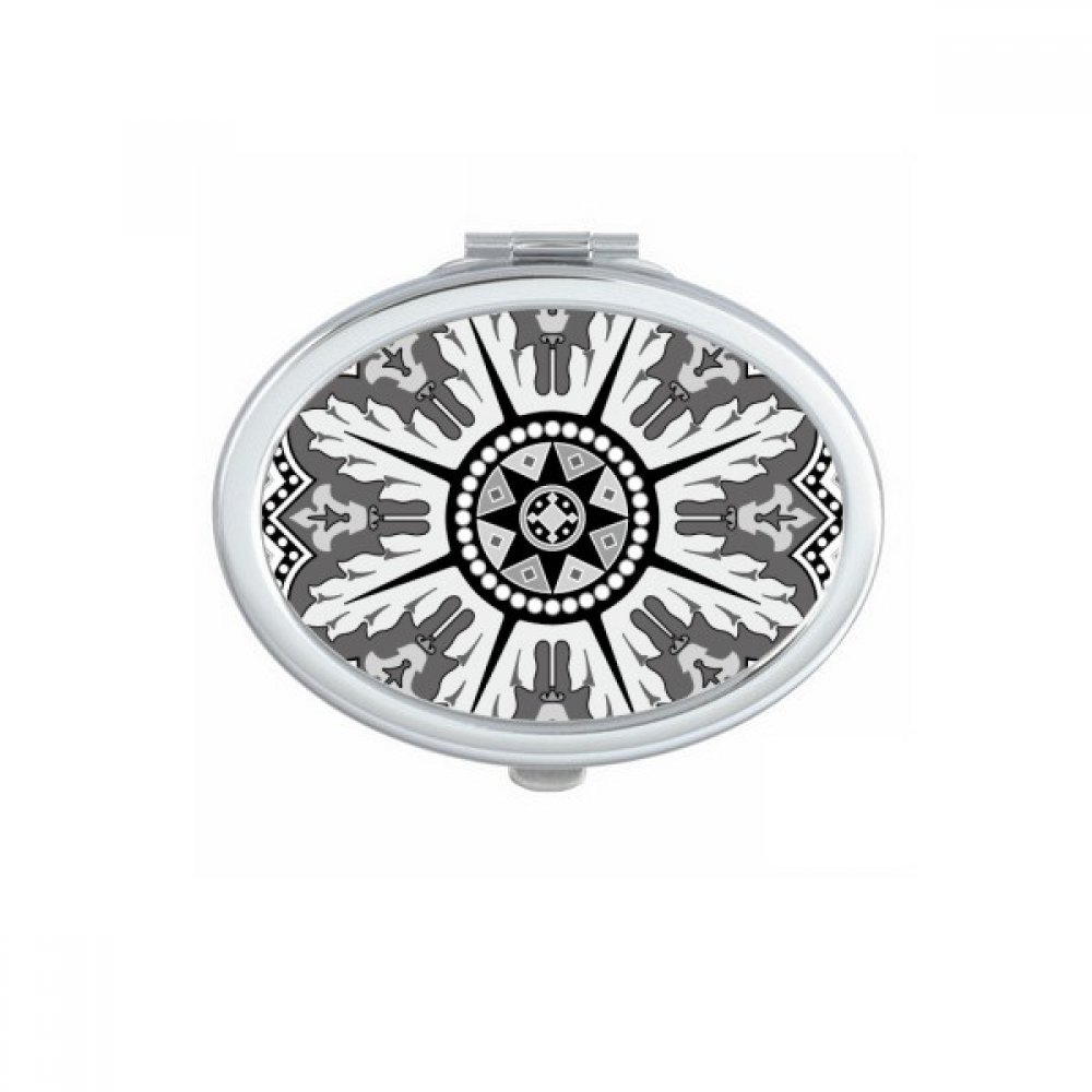 Miroir de poche à la main arabe noir blanc pour les retouches maquillage en voyage