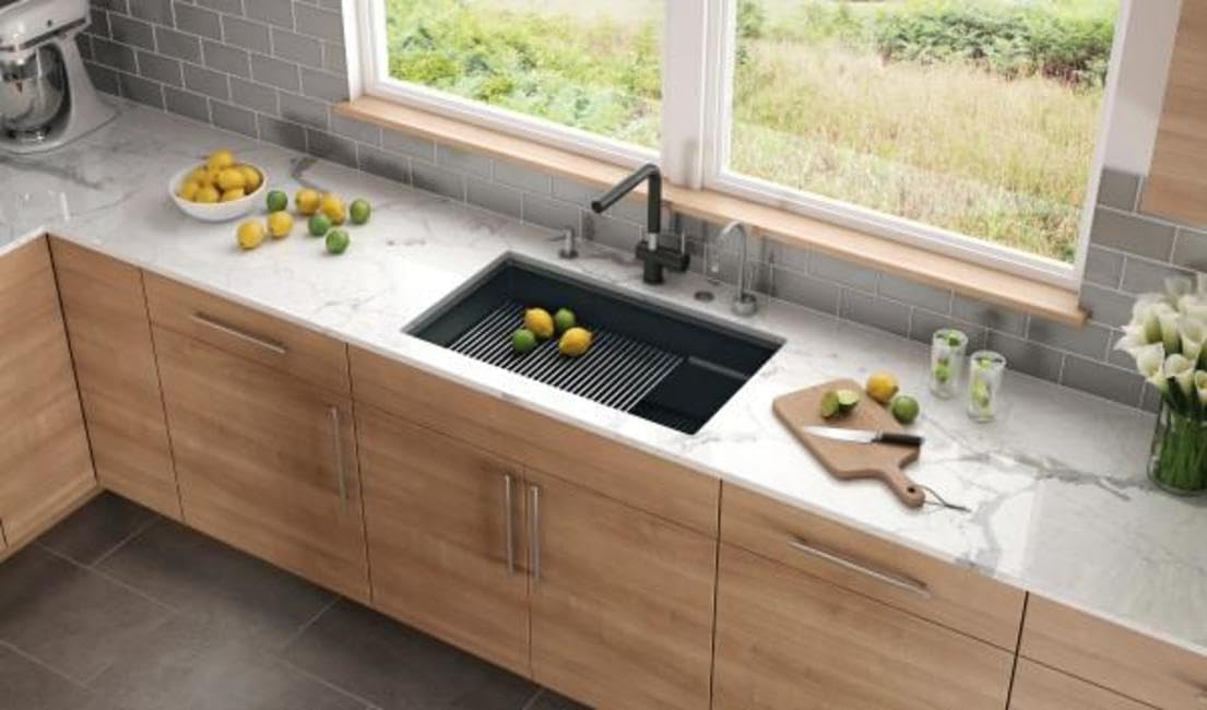 Franke PKG11031CHA sink installed in a kitchen with a drying rack and accessories.