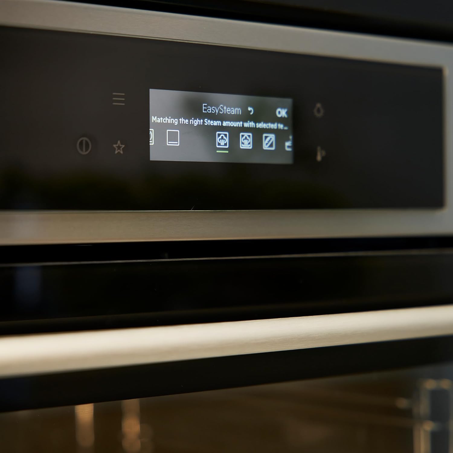Close-up of the oven's control panel displaying 'EasySteam' and steam amount icons
