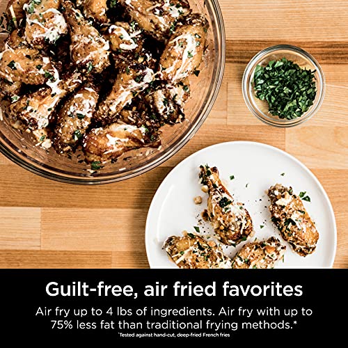 This is a picture of a product for sale called Ninja SP301 Dual Heat Air Fry Countertop 13-in-1 Oven with Extended Height,  XL Capacity,  Flip Up & Away Capability for Storage Space,  with Air Fry Basket,  SearPlate,  Wire Rack & Crumb Tray,  Silver