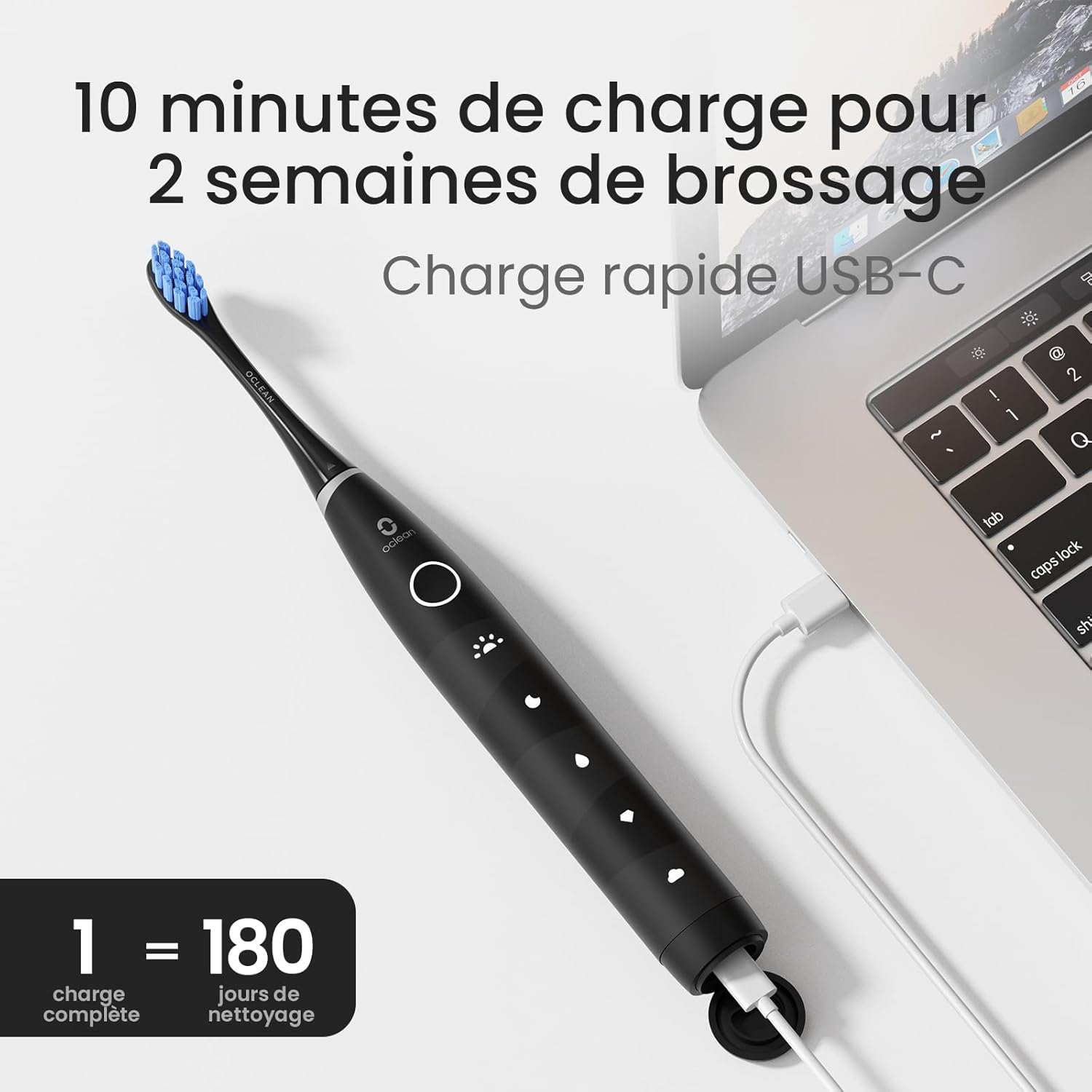 Oclean Flow toothbrush charging via USB-C cable connected to a laptop