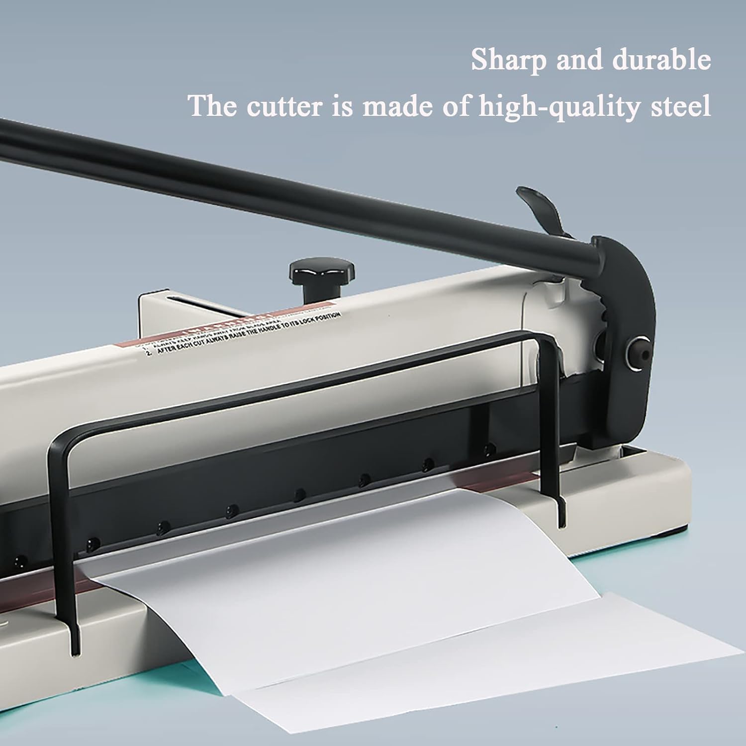 Πλευρά view of the paper cutter showing the sharp blade and the paper being fed. The text 'Sharp and durable The cutter is made of high-quality steel' is overlaid.