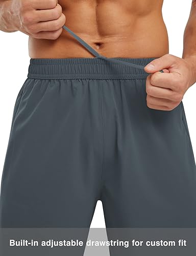 Miniatura 3 de TBMPOY Pantalones cortos de secado rápido para hombre de 7 pulgadas con bolsillos con cremallera, cintura elástica, ligeros, para gimnasio,