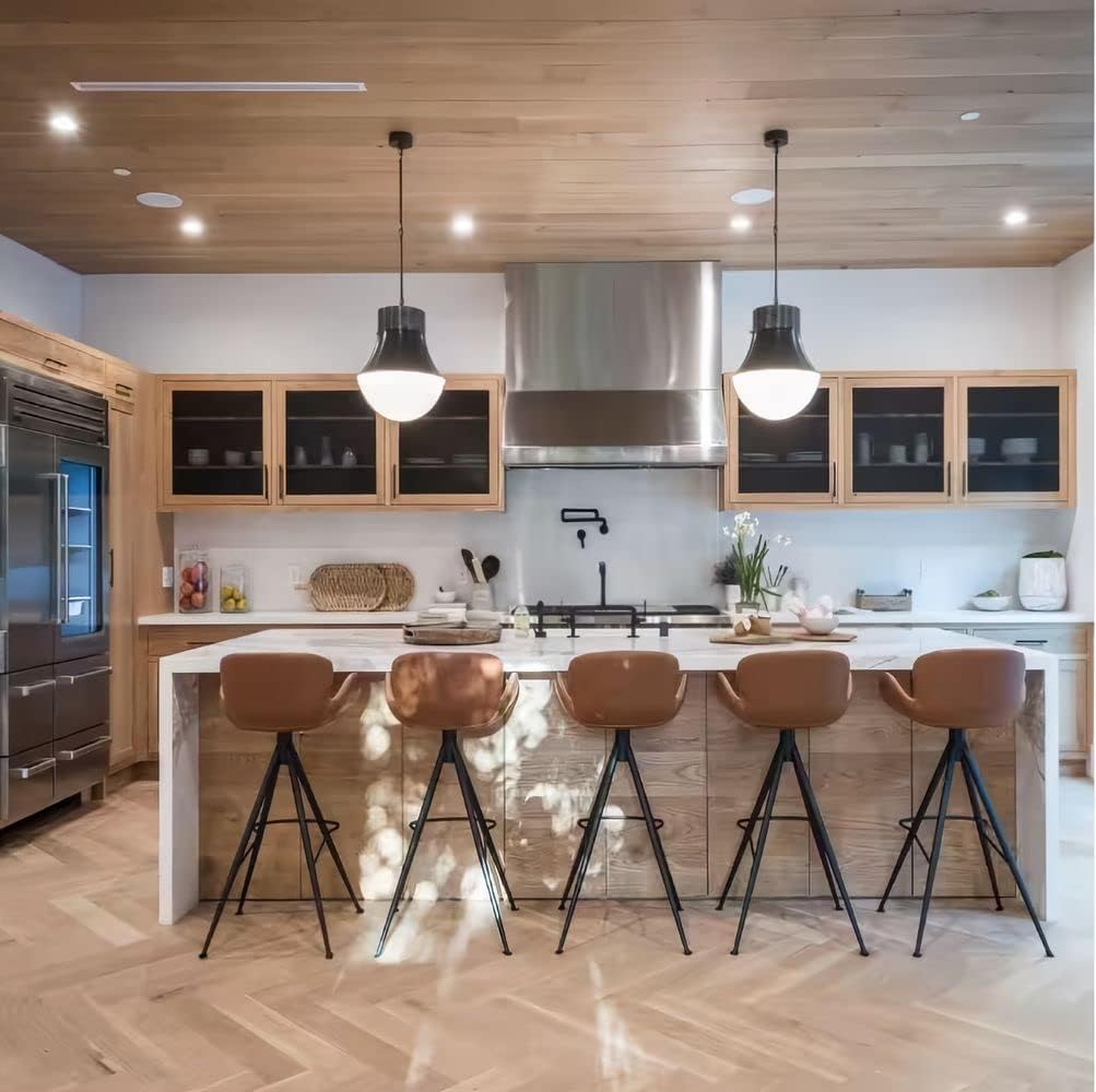 A modern kitchen illuminated by overhead lighting, demonstrating the bright and clear light output.