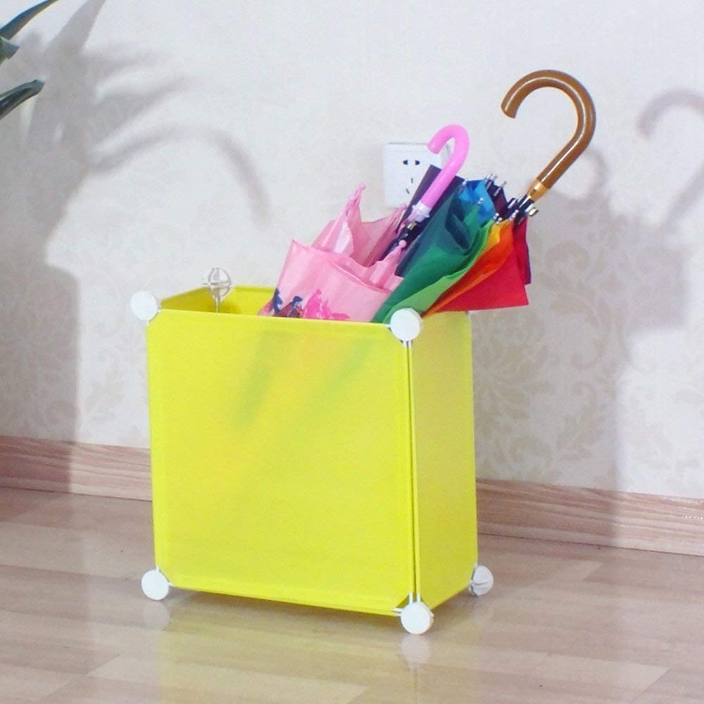 Tube de parapluie créatif jaune pour une décoration moderne d'hôtel