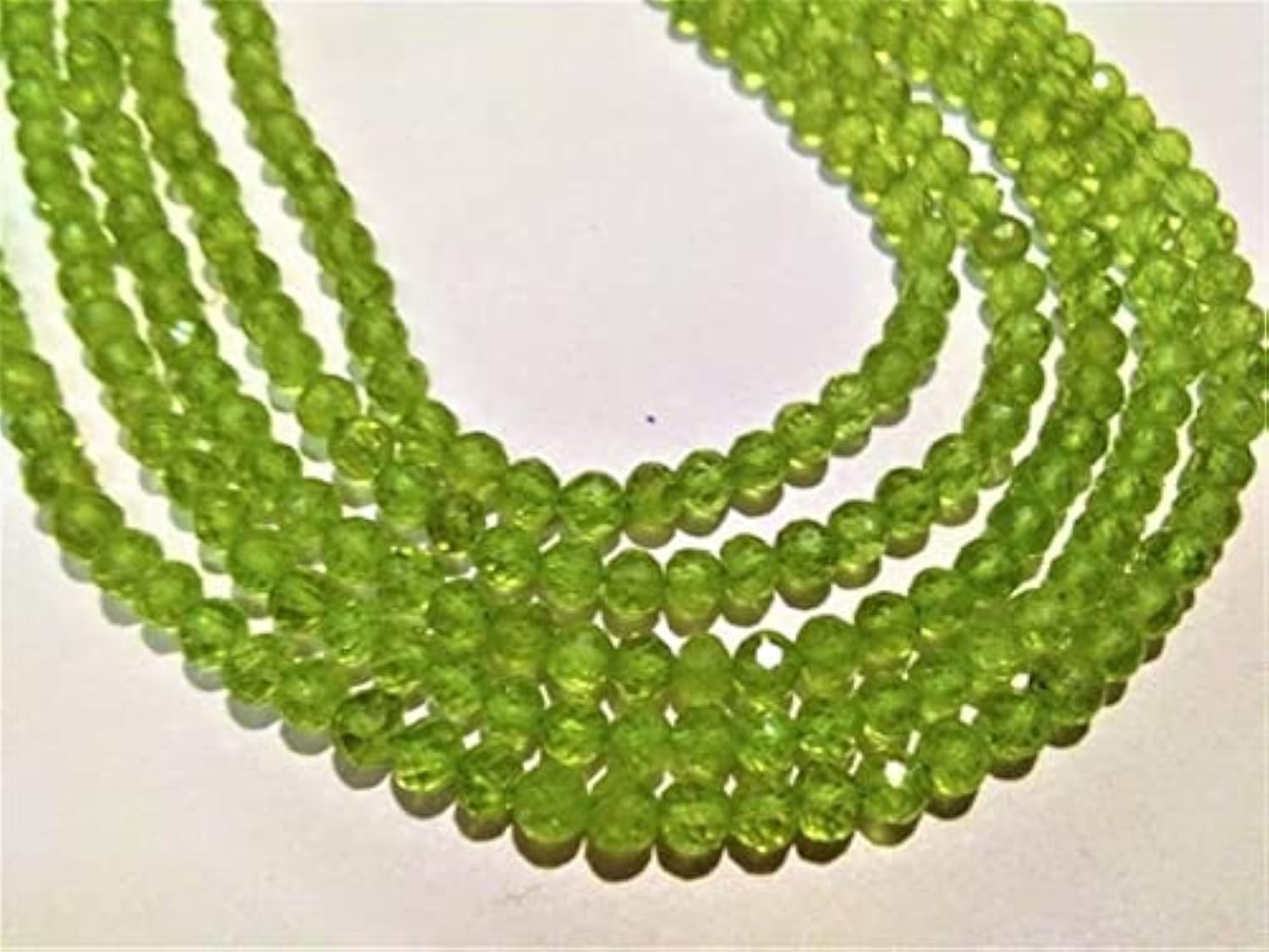 Peridot faceted round beads de 4mm : résolvez le manque d'éclat de vos bijoux